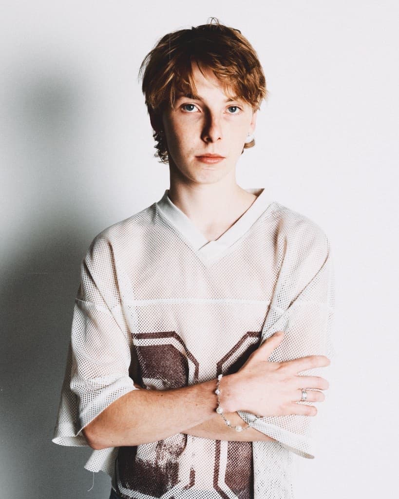 Arms crossed showing the pearl bracelet and silver ring