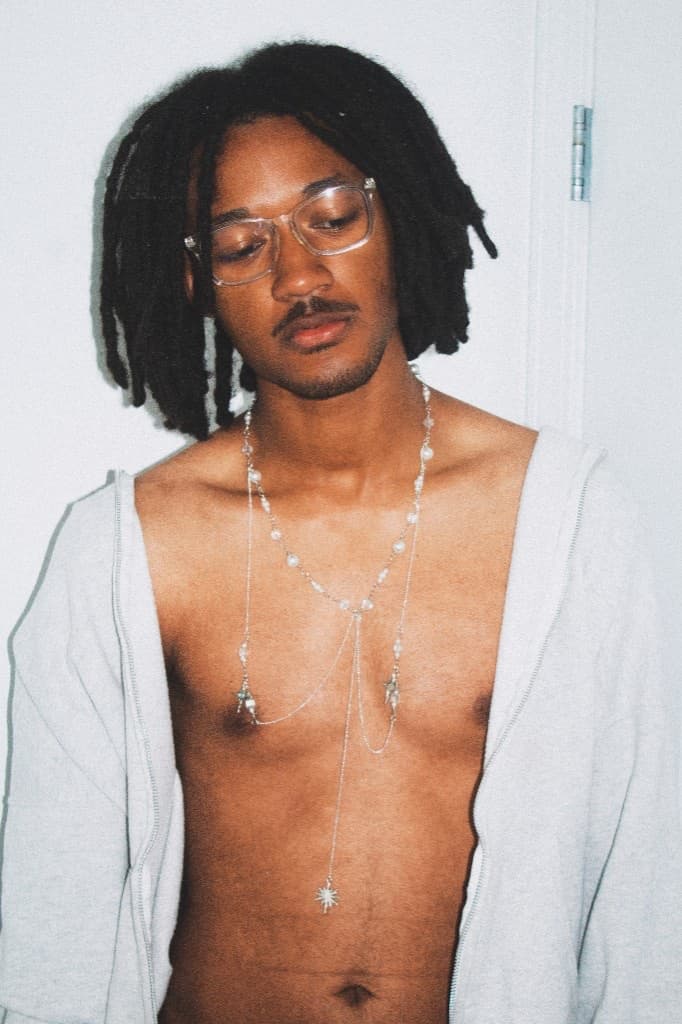 Standing portrait with the silver lariat necklace and star charm drop